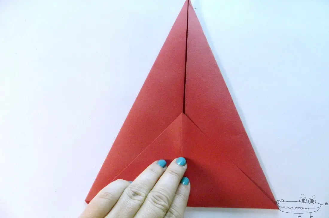 doblar la cartulina para formar un triángulo